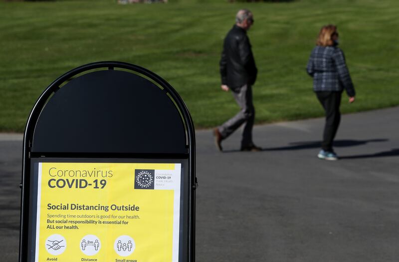 A sign with social distancing guidelines in the Botanic Gardens in Dublin. Photograph: Brian Lawless/PA Wire