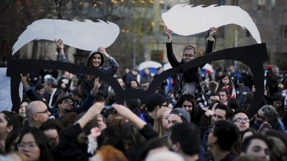 Audience members hold up props to match the eyebrows and glasses of US Democratic presidential candidate Bernie Sanders before Wednesday’s rally in Washington Square Park, New York. Photograph: Brian Snyder/Reuters