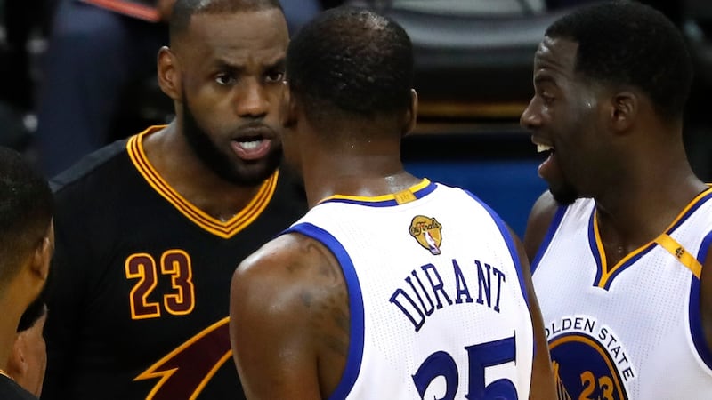 Golden State Warriors player Kevin Durant and Cleveland Cavaliers’ LeBron James exchange words on court in the second half of game five at Oracle Arena in Oakland, California. Photograph: PA