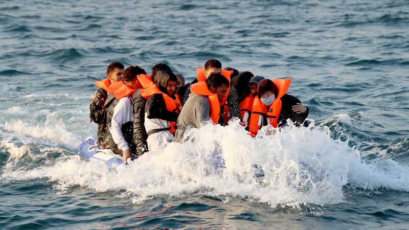 A group of people thought to be migrants crossing the Channel in a small boat headed in the direction of Dover, Kent, last August. Photograph: Gareth Fuller/PA Wire