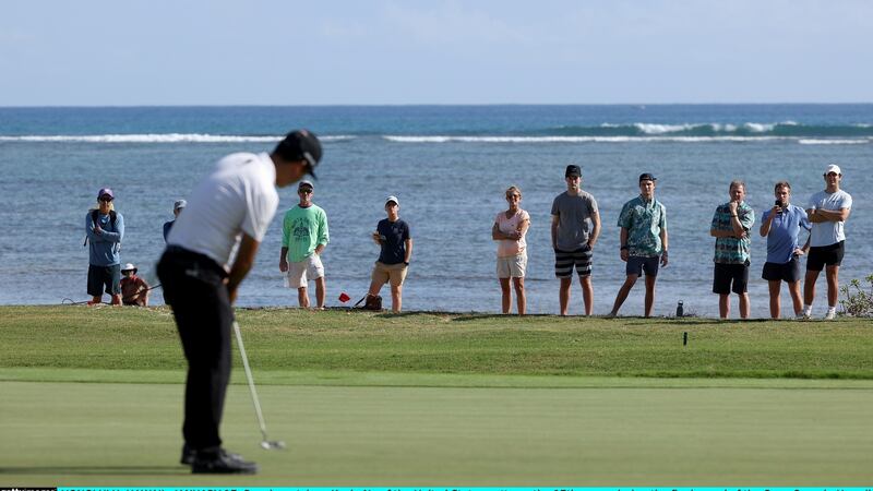 Kevin Na putts on the 17th green during the final round of the Sony Open in Hawaii. Photo: Gregory Shamus/Getty Images