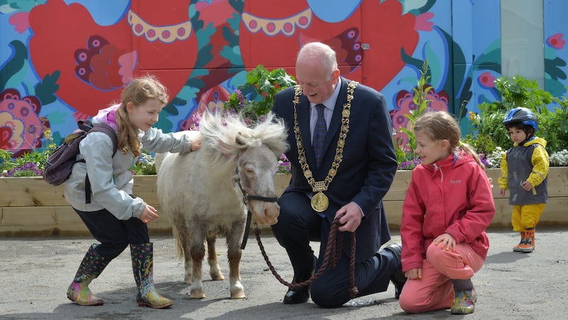 Lord Mayor of Dublin Nial Ring with Moses, the 17-year-old miniature pony, and Ella and Lynn Spitzer Beirne on the opening day of Dublin City Council’s first urban farm. Photograph: Alan Betson / The Irish Times