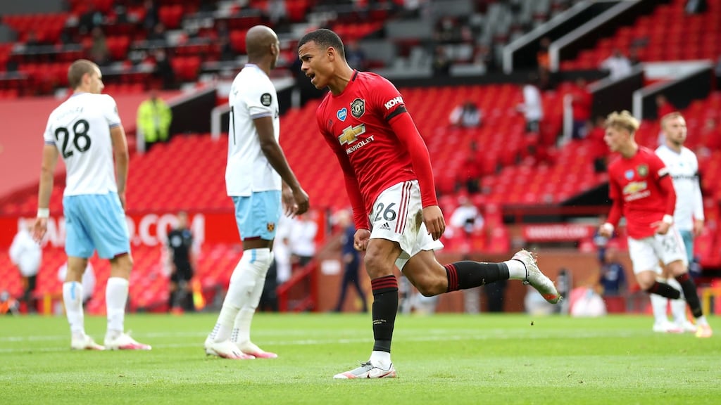 Mason Greenwood of Manchester United celebrates after scoring his team’s first goal during the Premier League match between Manchester United and West Ham United at Old Trafford. Photo: Catherine Ivill/Getty Images