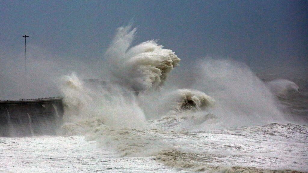 Waves crash over the harbour wall in Dover, Kent, as Storm Angus hit the UK. Photograph: Gareth Fuller/PA Wire