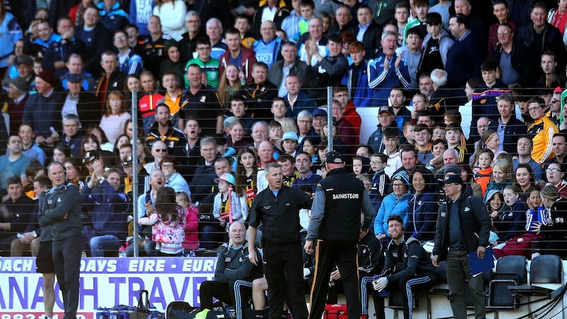 Brian Cody has words with Dublin selector Greg Kennedy following the latter’s unorthodox intervention in the game at Nowlan Park. Photograph: Ryan Byrne/Inpho