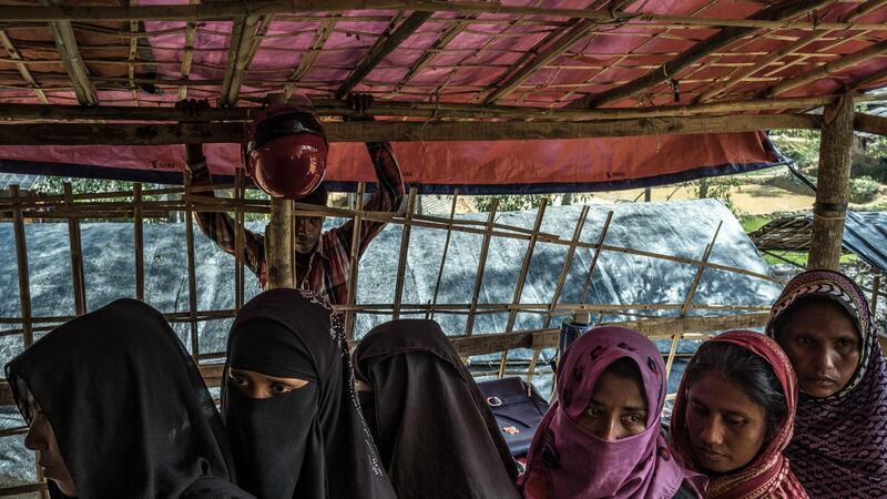 Rohingya women wait at the World Food Programme distribution point in the Tchainkali refugee camp in Bangladesh, on September 30th. Photograph: Sergey Ponomarev/The New York Times