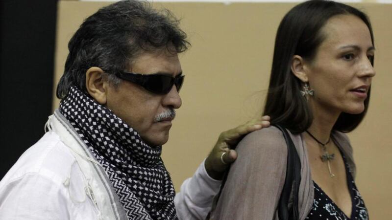 Farc member Jesus Santrich walks next to Tanja Nijmeijer of Netherlands, an active Farc member, as they arrive for the conference in Havana. Photograph: Enrique De La Osa/Reuters