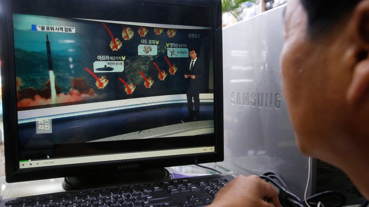 A South Korean man watches a computer screen displaying news broadcasts reporting on North Korea’s threat to possibly fire four intermediate-range ballistic missiles around the US island territory of Guam. Photograph: Jeon Heon-Kyun/EPA