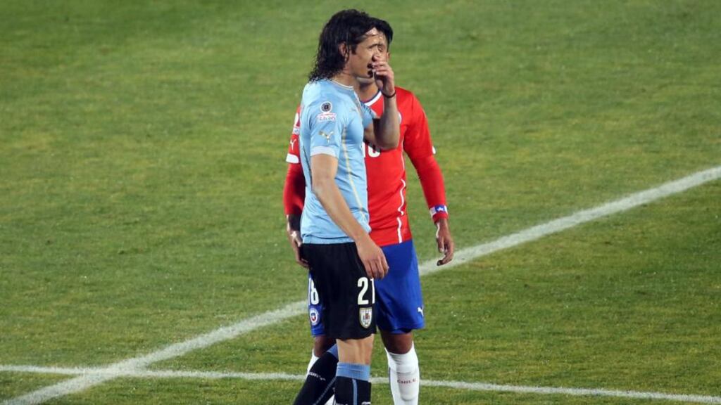Gonzalo Jara was seen to prod a finger into Edison Cavani’s bottom during the Copa America clash between Chile and Argentina. Photo: Claudio Reyes/Getty Images