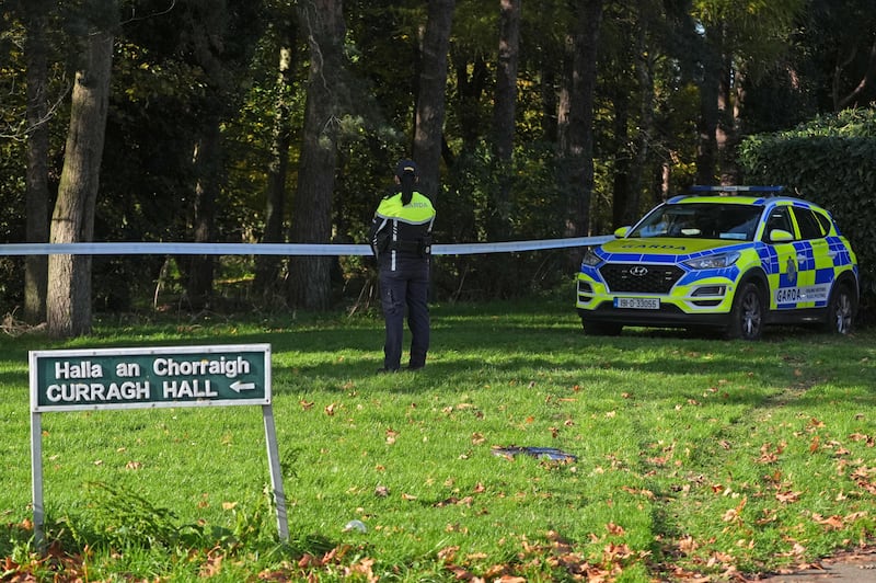 A garda stands by a cordon in Curragh Hall, Tyrrelstown, on Sunday. Photograph: Brian Lawless/PA Wire