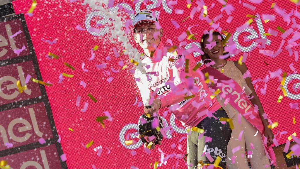 The new overall leader, Andre Greipel of Lotto Soudal, celebrates on the podium after winning the second stage of the 100th Giro d’Italia. Photo: Getty Images