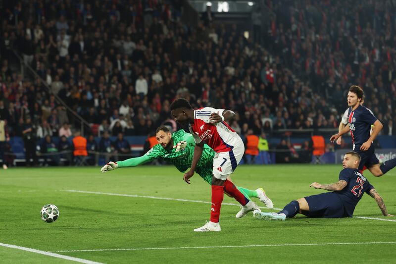 Arsenal's Bukayo Saka scores past PSG goalkeeper Gianluigi Donnarumma. Photograph: Richard Heathcote/Getty Images
