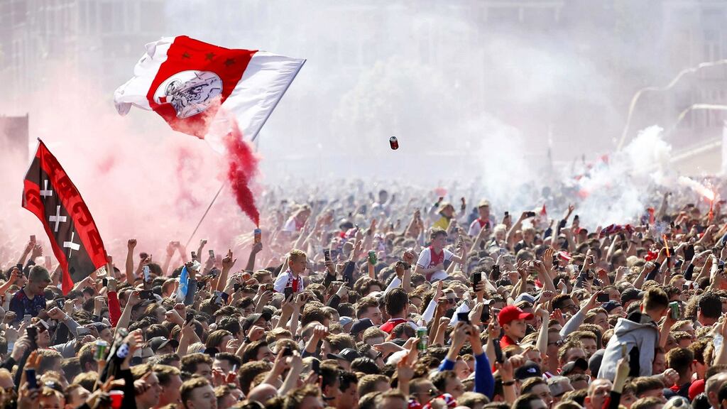 Ajax fans gather to celebrate winning the league title last year. Photo: Robin Van Lonkhuijsen/EPA