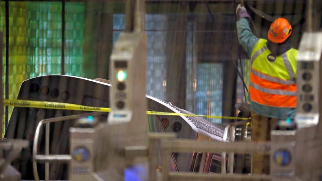 A Chicago Transit Authority train rests on an escalator at the O’Hare Airport station after it derailed this morning. Photograph: Reuters