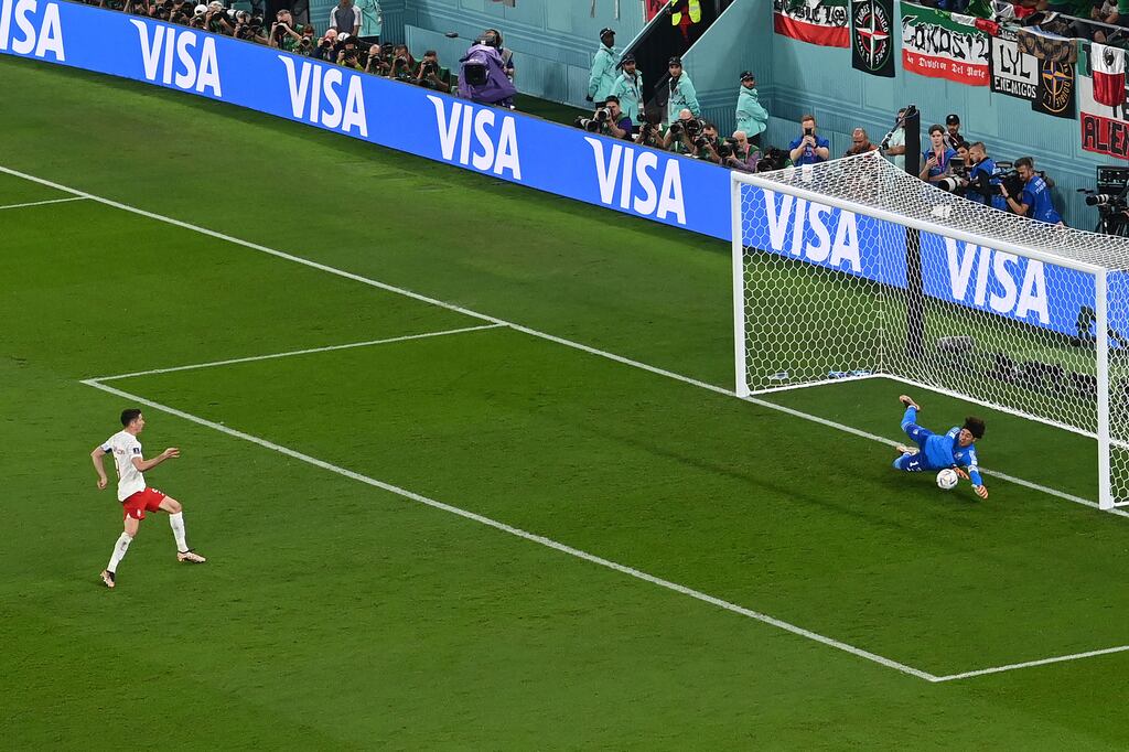 Mexico's goalkeeper Guillermo Ochoa saves a penalty kick by Poland's Robert Lewandowski during World Cup Group C match at Stadium 974. Photograph: Glyn Kirk/AFP via Getty Images