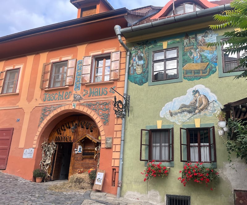 Murals on building facades in Sighișoara old town