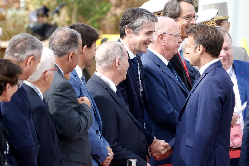 Thales chief executive Patrice Caine greets French president Emmanuel Macron at the International Paris Air Show in 2023. Photograph: Ludovic Marin/ AFP via Getty Images