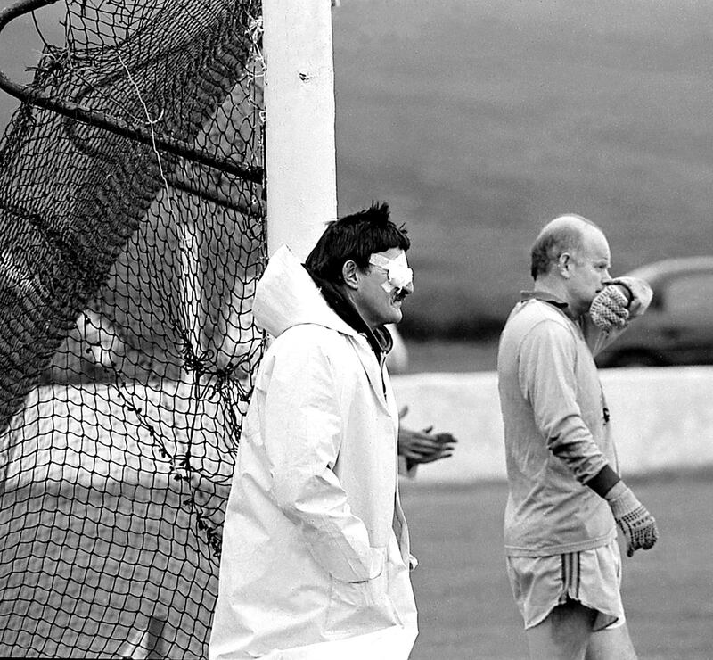 'This umpire could definitely do with the assistance of Hawkeye! Kiltane goalkeeper Richard Cosgrove is keeping a close eye on the game for both of them.' Photograph: Henry Wills