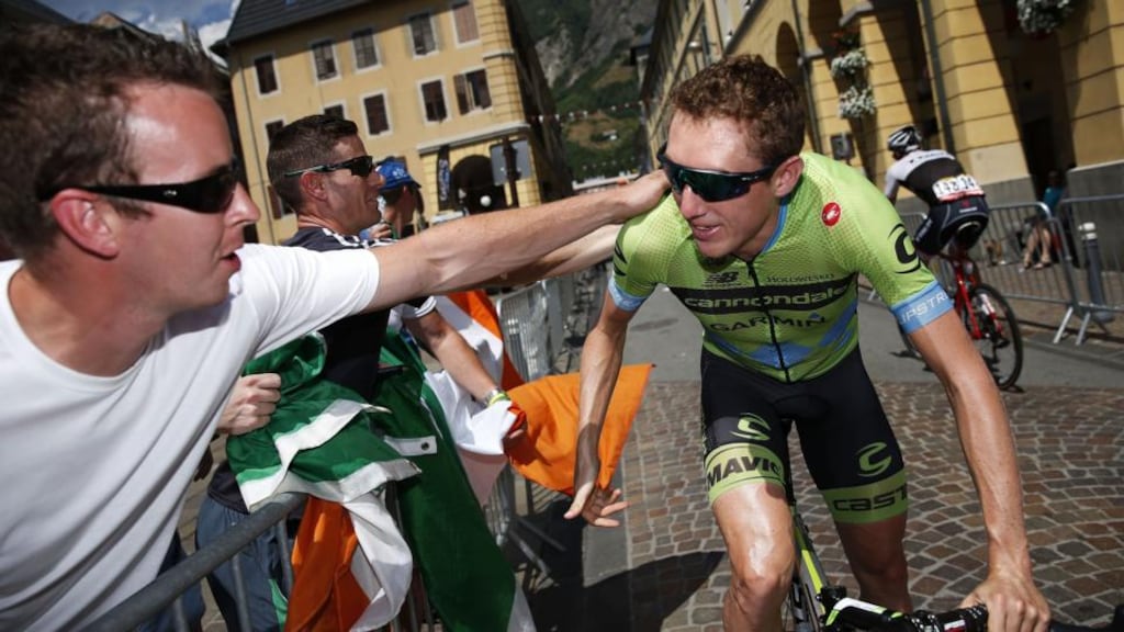 Dan Martin  greets fans before the start of Stage 19 of the  Tour de France between Saint-Jean-de-Maurienne and La Toussuire. Photograph: Doug Pensinger/Getty Images