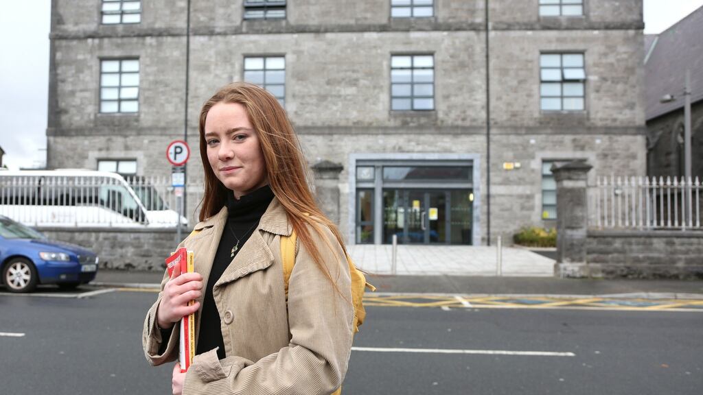 Kate Ryan, one of about 2,000 students due to sit the delayed Leaving Cert exam, outside the school she attended, Coláiste Iognáid at Sea Road in Galway city. Photograph: Joe O’Shaughnessy