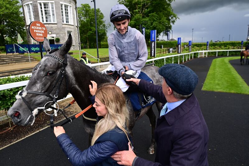 Fallen Angel and Danny Tudhope are congratulated by trainer Karl Burke with groom Alice Kettlewell at the Curragh. Photograph: Healy Racing/PA Wire