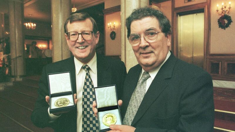 Nobel Peace Prize winners David Trimble and John Hume display the Alfred Nobel medals in Oslo City Hall in 1998. Photograph: Matt Kavanagh