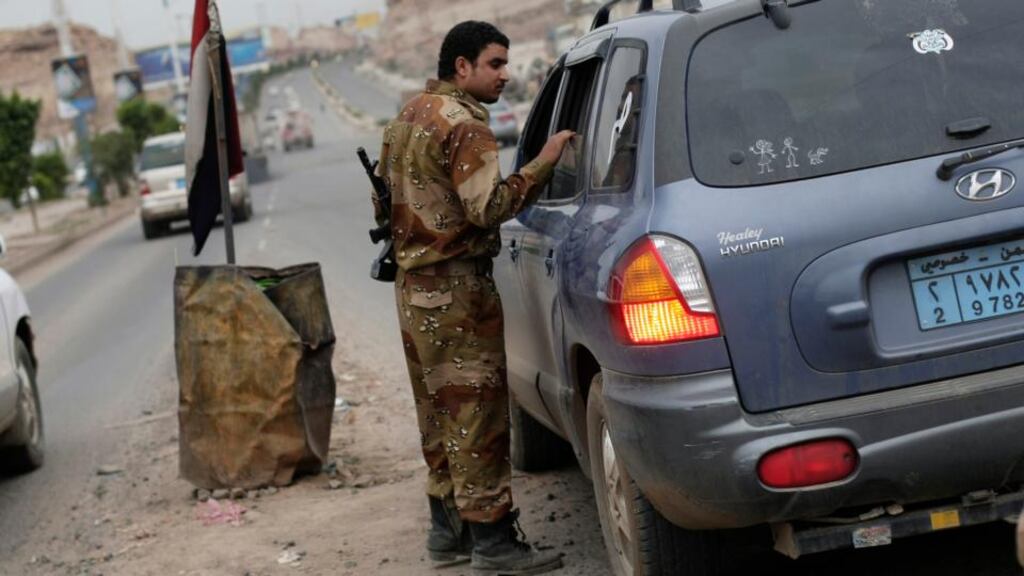 A Yemeni soldier stops a car at a checkpoint in a street leading to the US embassy in Sanaa, Yemen. The US military evacuated non-essential US government personnel from Yemen yesterday, due to the high threat of attack by al-Qaeda. Photograph: Hani Mohammed