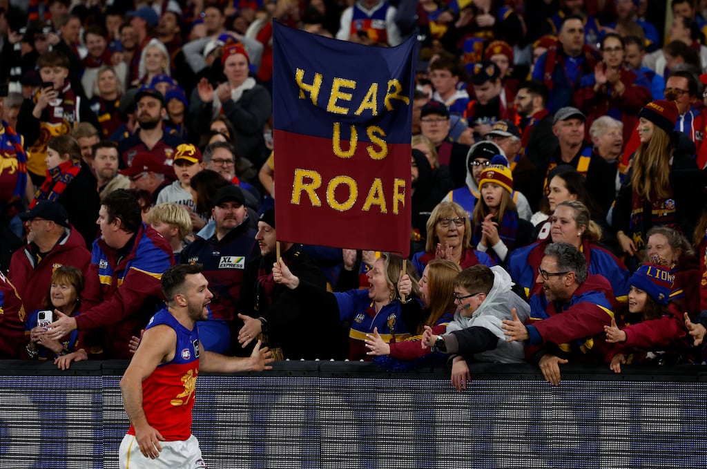 Conor McKenna of the Brisbane Lions celebrates with fans during the AFL Second Preliminary Final match against the Geelong Cats at the Melbourne Cricket Ground. Photograph: Michael Willson/AFL Photos via Getty Images