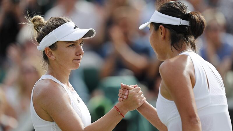 Simona Halep shakes hands with Peng Shuai after their third round clash. Photo: Adrian Dennis/Getty Images