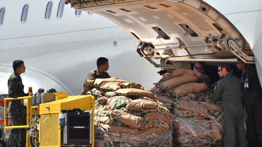 Brazilian soldiers unload humanitarian aid for Venezuela from a Brazilian Air Force plane shortly after landing at Ala 7 air base in Boa Vista, Roraima, Brazil. Photograph: Nelson Almeida/AFP/Getty