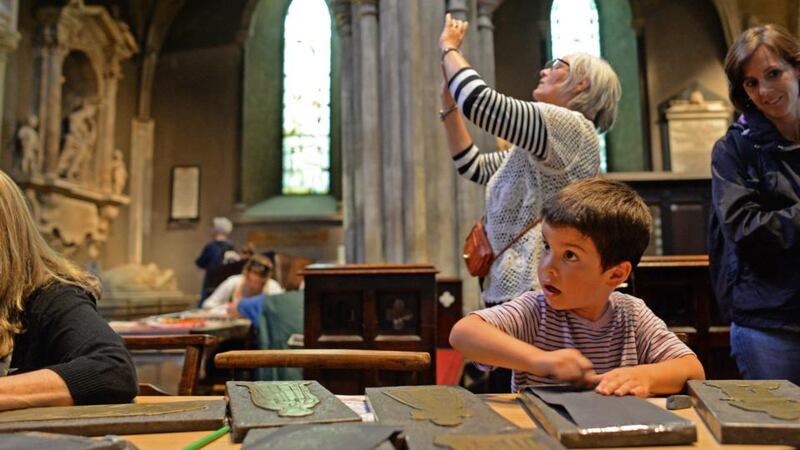 Koen Mehta, from Minissota in the United States, takes part in brass-rubbing at St Patrick’s Cathedral, Dublin, as part of National Heritage Week. Photograph: Dara Mac Dónaill
