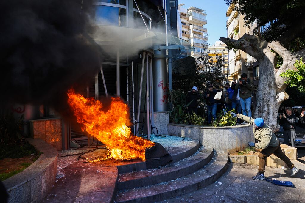 A protester throws a brick at a bank after setting fire to tyres during a demonstration in Beirut on February 16th. Photograph: Joseph Eid/AFP via Getty