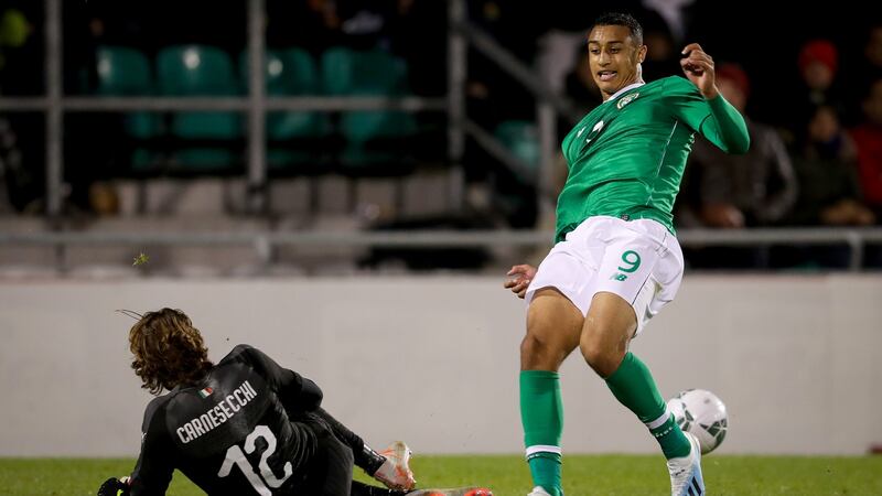 Ireland striker Adam Idah in action against Italy goalkeeper Marco Carnesecchi during the Under-21 European Championship qualifier at Tallaght stadium. Photograph: Oisín Keniry/Inpho