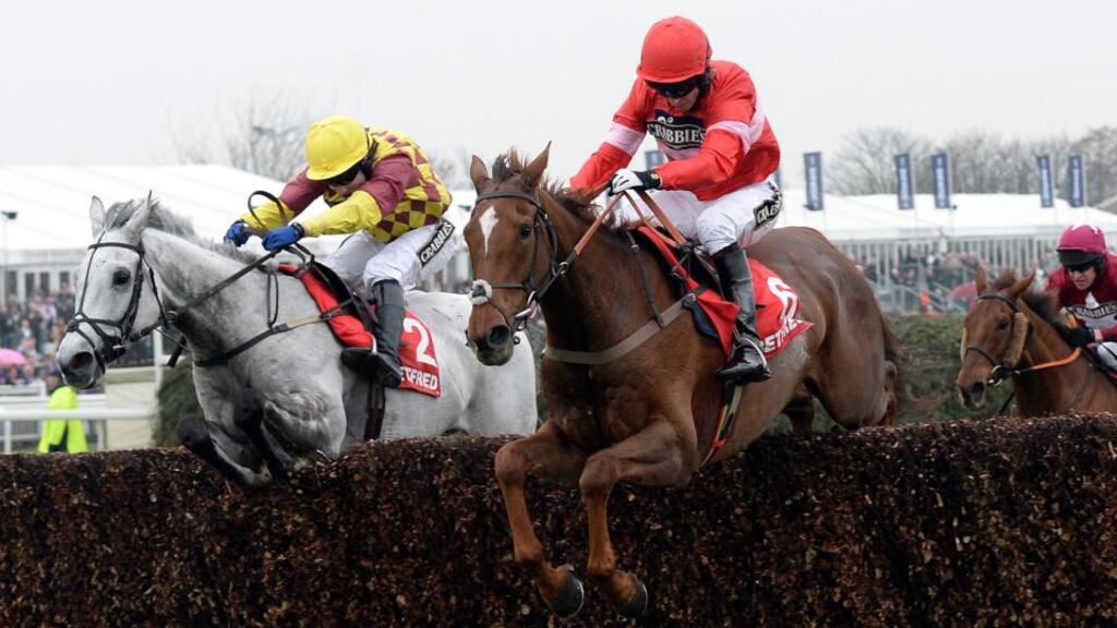 Silviniaco Conti and Noel Fehily (right) win the Betfred Bowl Chase from Dynaste and Tom Scudamore during the Crabbie’s Grand National 2014. Photograph: John Giles/PA Wire