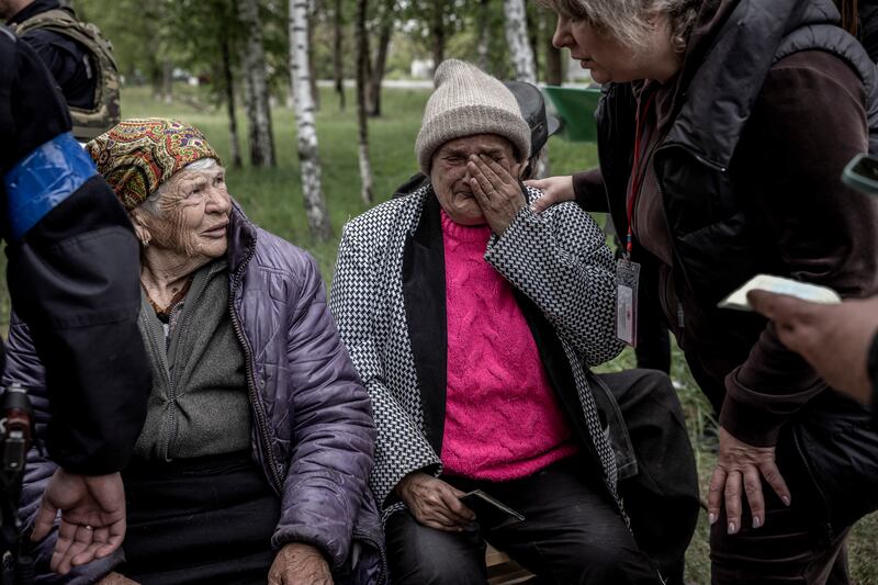 Residents evacuated from Vovchansk on the journey to the regional capital of Kharkiv. Photograph: Finbarr O'Reilly/New York Times