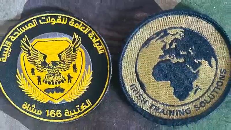 The uniform Insignia of Irish Training Solutions (right) beside the 166 Infamtry Brigade's badge