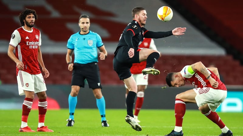 Sean Murray challenges Granit Xhaka for the ball. Photo: Tommy Dickson/Inpho