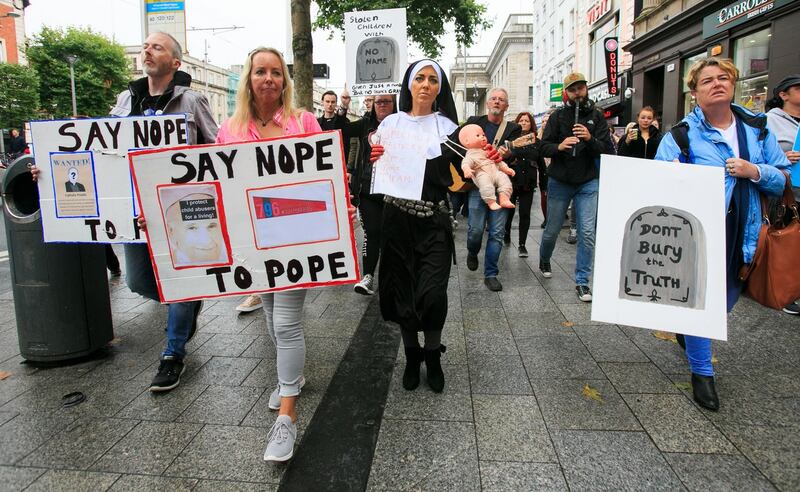 Members of the public
particpate in a protest at the GPO, Dublin, against the visit of Pope Francis to Ireland. Photograph: Gareth Chaney/Collins