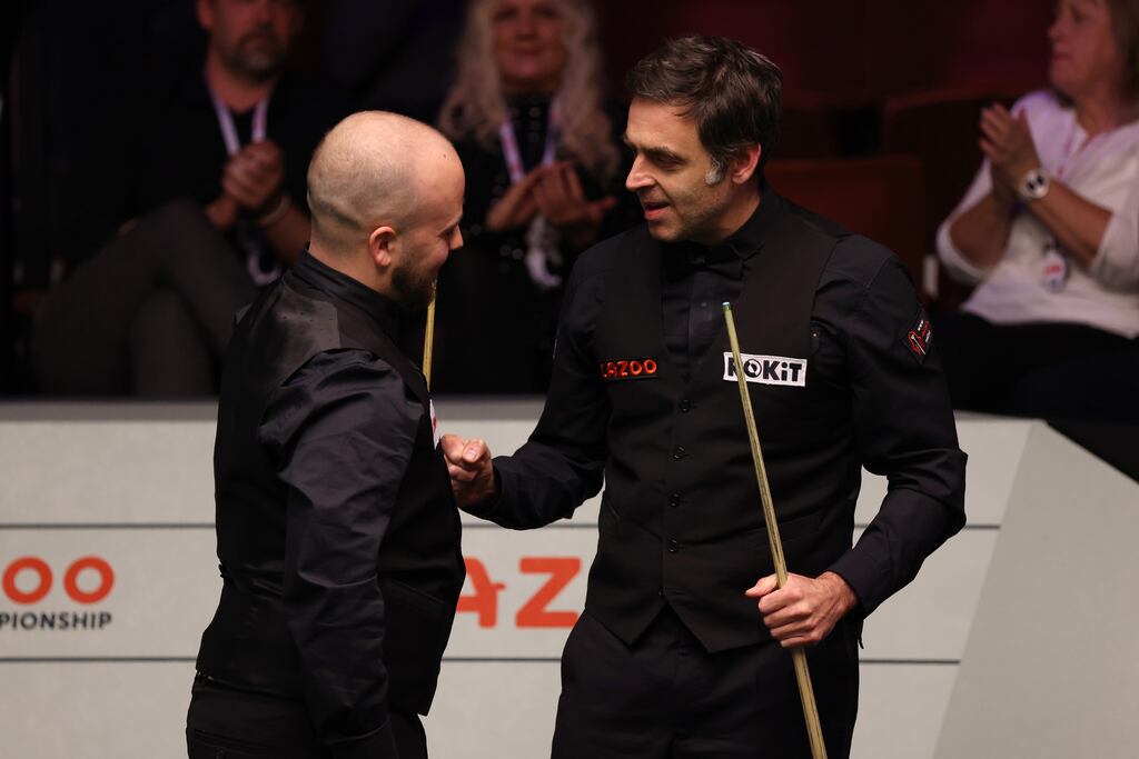 Ronnie O'Sullivan congratulates Luca Brecel after losing to the Belgian in the quarter-finals of the World Snooker Championship at Crucible Theatre in Sheffield. Photograph: George Wood/Getty Images