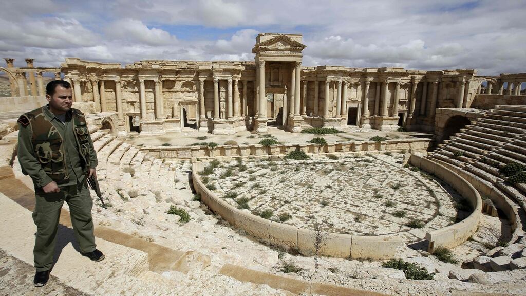 File photo taken in March 2014 shows Syrian policeman patrols the ancient oasis city of Palmyra, 215 kilometres northeast of Damascus. Photograph: Joseph Eid/AFP/Getty Images