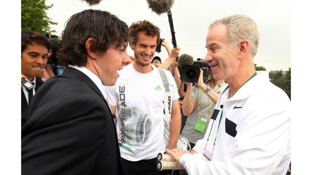 Rory McIlroy shares a joke with Andy Murray and John McEnroe on one of the practice courts this morning. Photograph: Stephen Pond/PA Wire