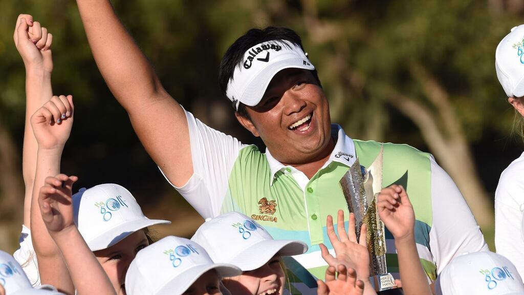 Thailand’s Kiradech Aphibarnrat holds the trophy after winning the World Super 6 in Perth. Photo: Greg Wood/Getty Images