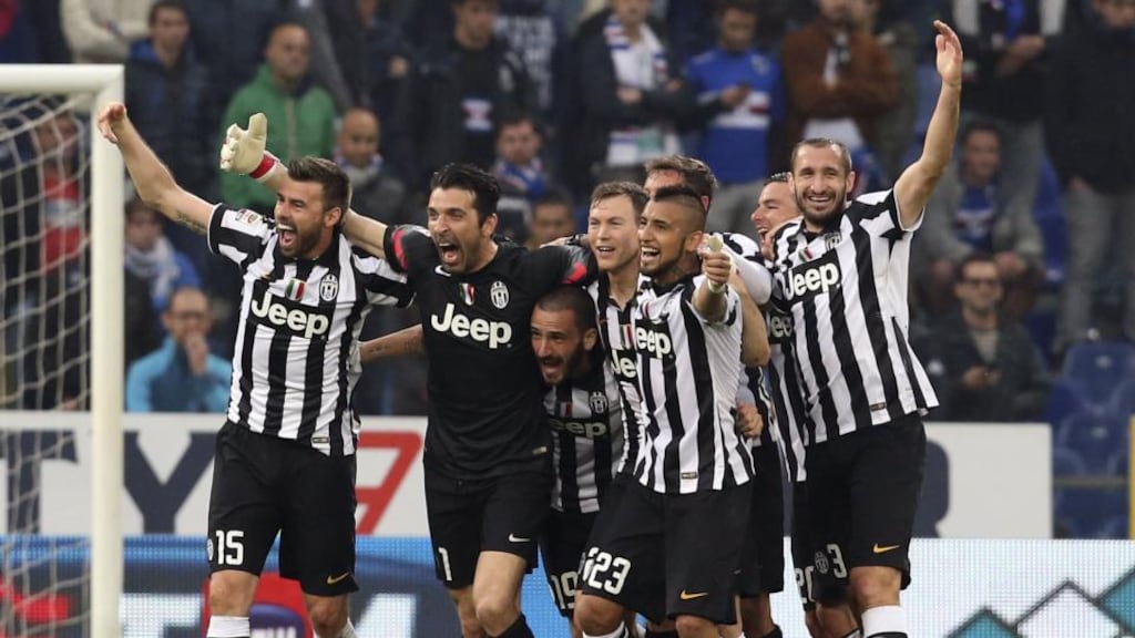 Juventus players celebrate at the end of their Serie A match against Sampdoria at the Marassi Stadium in Genoa to win their fourth successive league title. Photograph: Reuters.
