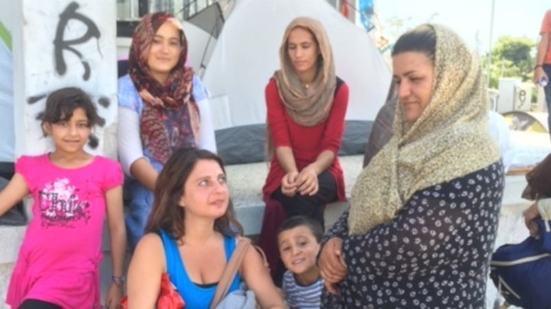 Christy Lefteri with refugees outside the centre in Athens where she volunteered in 2016.