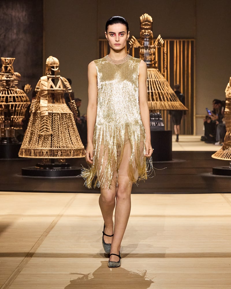 Elegant evening wear included fringed gold dresses