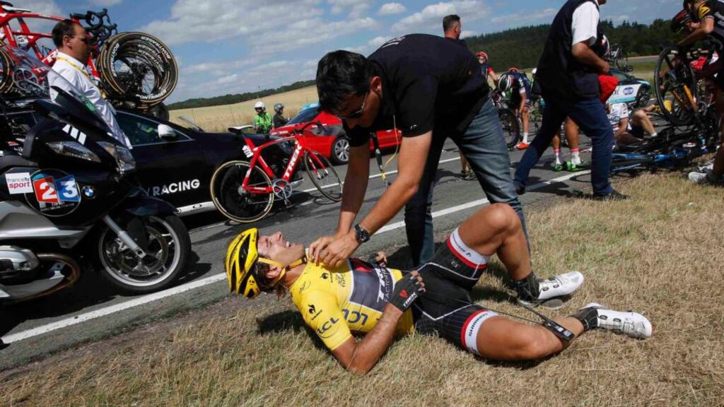 Trek Factory rider Fabian Cancellara of Switzerland receives assistance after a fall during the 159,5km third stage of the Tour de France from Anvers to Huy, Belgium. Photograph: Reuters