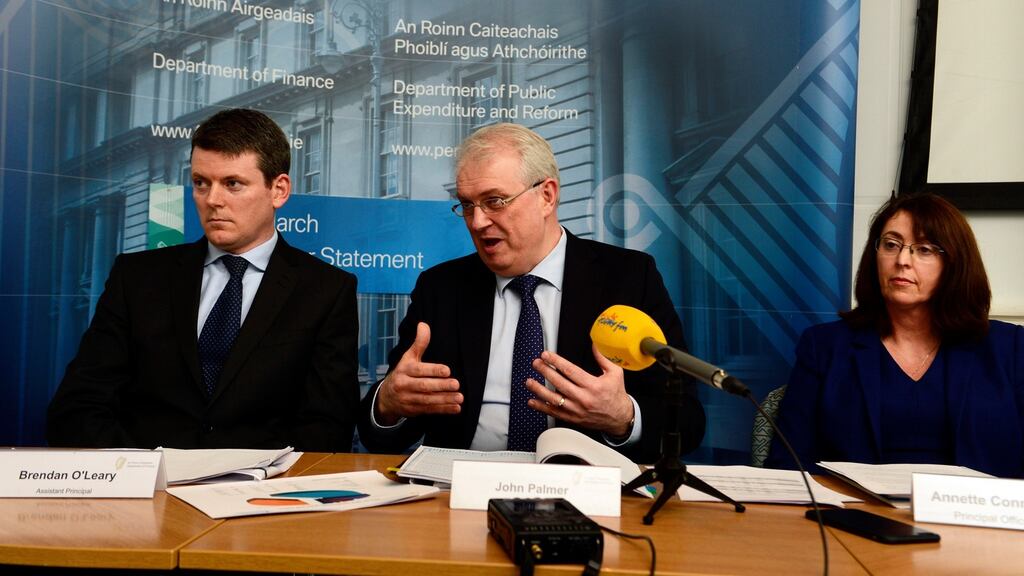Department of Finance principal officer John Palmer with assistant principal Brendan O’Leary, left, and Annette Connolly, principal officer at the Department of Public Expenditure and Reform, announcing the exchequer returns for the first quarter. Photograph: Cyril Byrne/The Irish Times