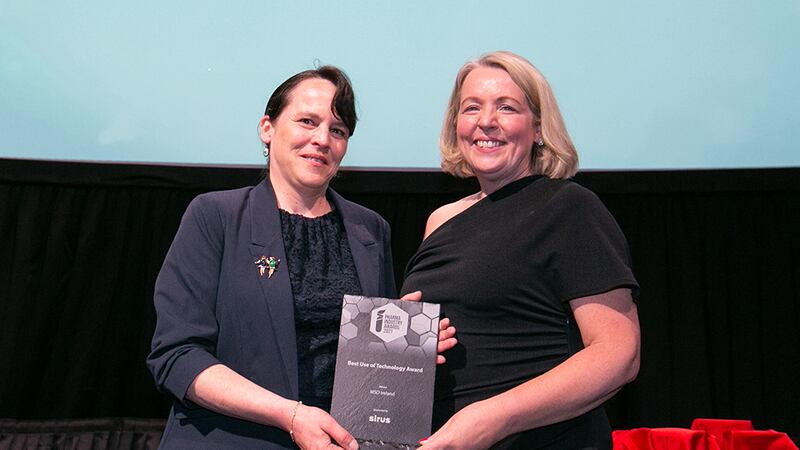 Michael White, Managing Director, Sirus, presents the Best Use of Technology Award to Mairead McCaul, MSD Ireland.