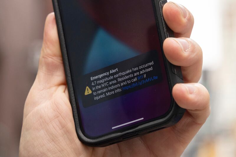 An emergency alert on a smartphone after the earthquake near New York. Photograph: Yuki Iwamura/AP