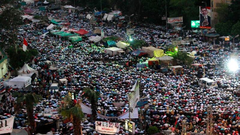 Supporters of president Mohamed Mursi perform evening prayers at the Rabaa Adawiya square where they are camping in Cairo yesterday. Photograph: Louafi Larbi/Reuters